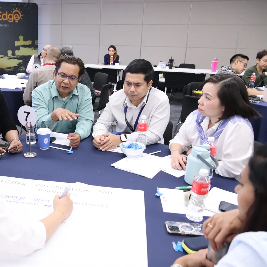 A trainer reinforcing learning with participants back at work