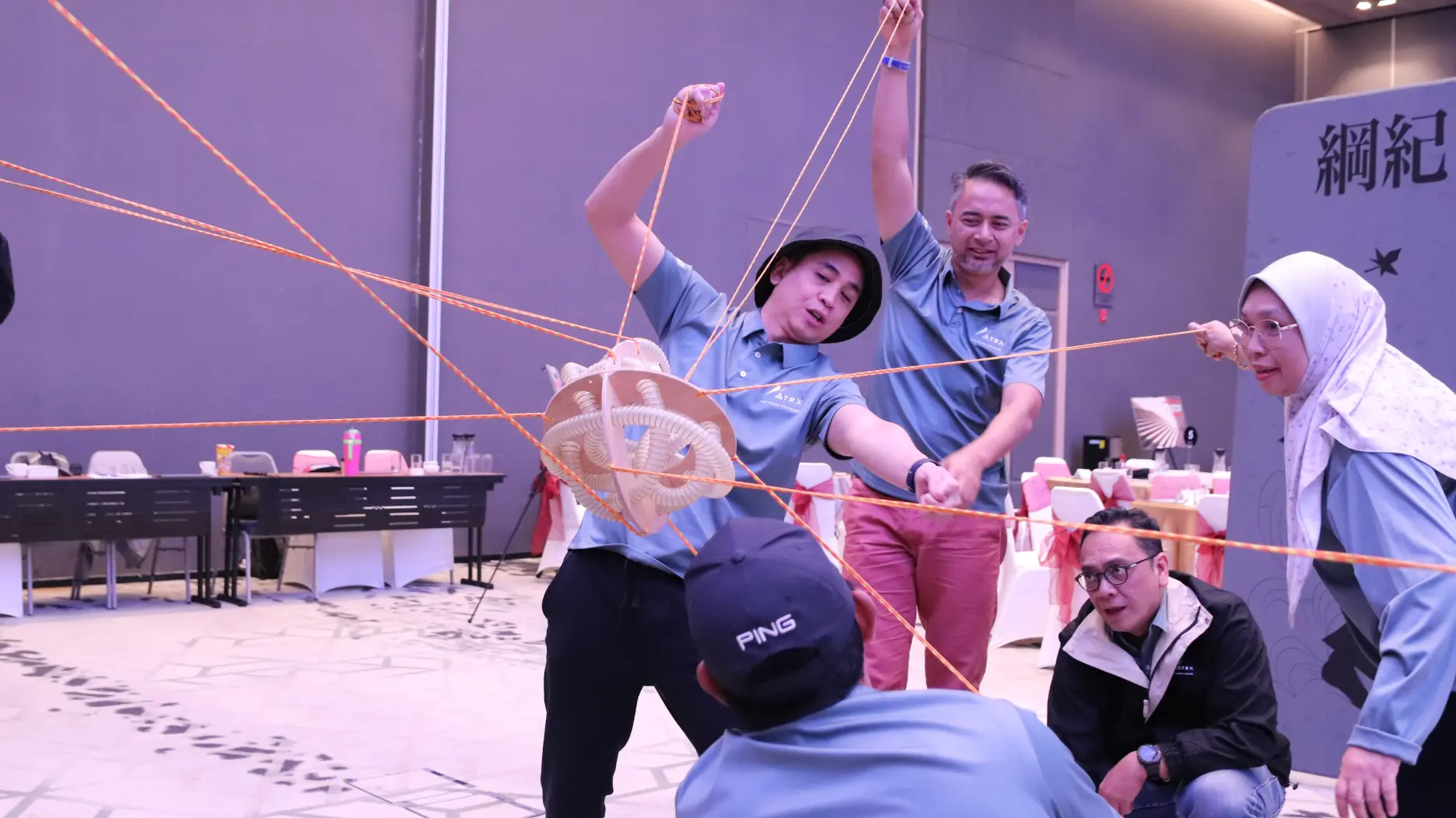 A Learning Edge trainer engaging a seated cohort during a live team programme session
