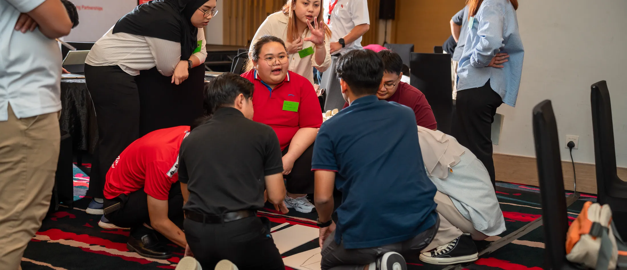 A Protege programme cohort collaborating on a workplace-readiness exercise